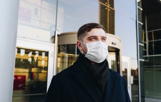 Man in a mask outside building, Platinum Resumes, Kansas City, MO