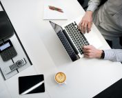 Man on laptoop with coffee, Platinum Resumes, Kansas City, MO