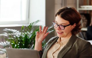 Woman in glasses at laptop, Platinum Resumes, Kansas City, MO