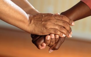 2 people hands clasped, Platinum Resumes, Kansas City, MO