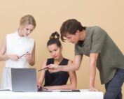 3 young people gathered around a laptop, Platinum Resumes, Kansas City, MO