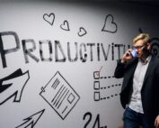 Man in front of white board that says productive, Platinum Resumes, Kansas City, MO